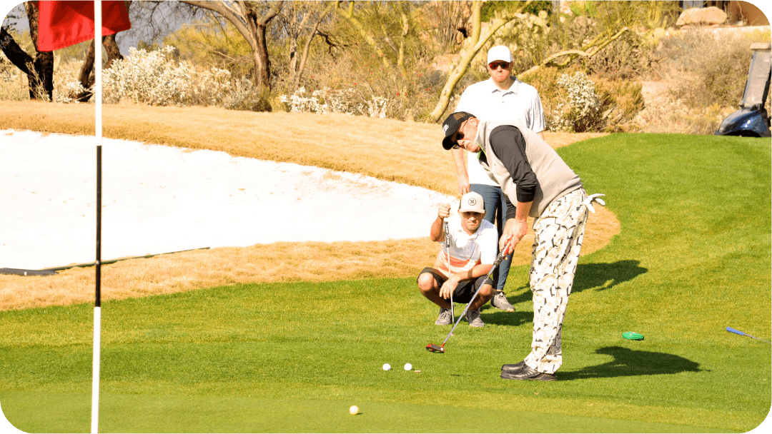 man putting at golf fundraiser